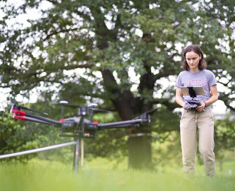 A student does tree research using drones at Armour College of Engineering