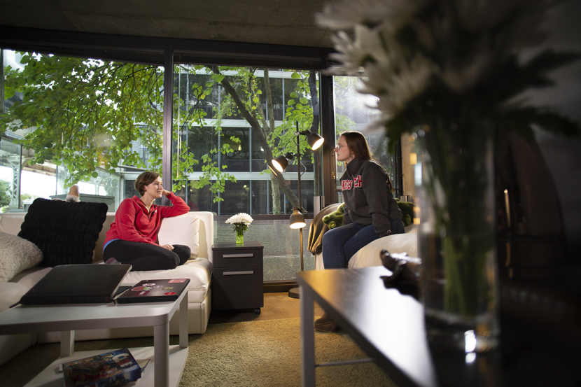 A student chats with her RA in State Street Village