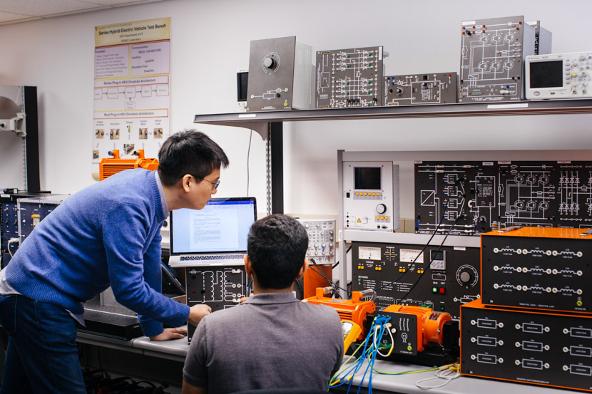 Photo of electrical engineering faculty and student in a lab