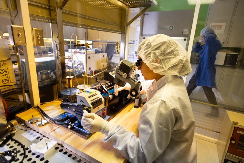 Photo of student at work in a clean room