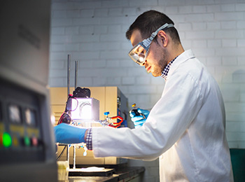 Illinois Tech male student with googles in lab