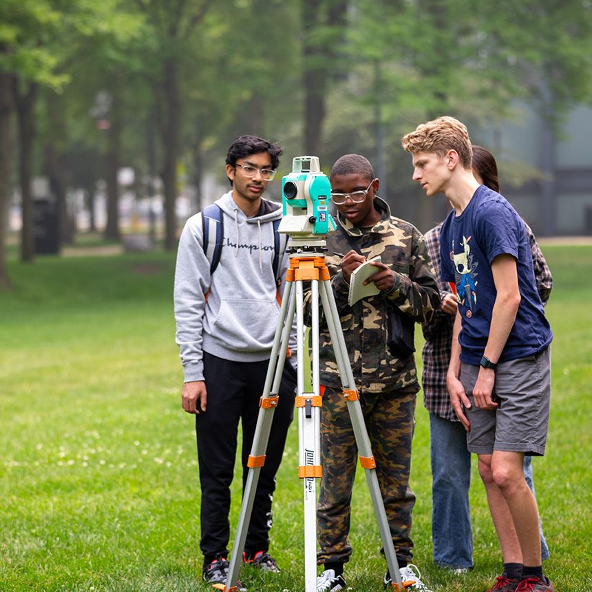 Summer program participants take part in a surveying program in July 2023