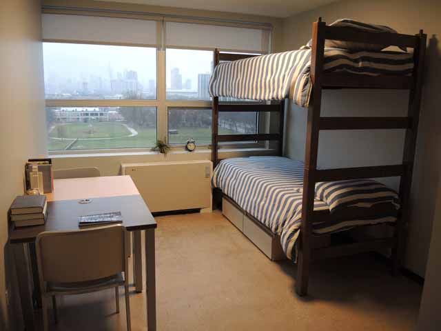 Kacek Hall Dorm Room Image with bunk beds and desk with chair