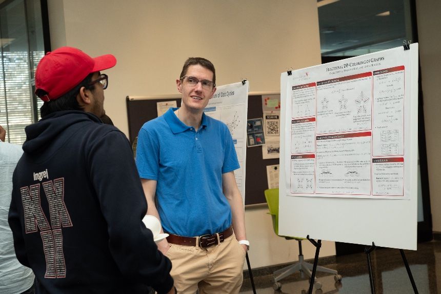 Mathematics students presenting research