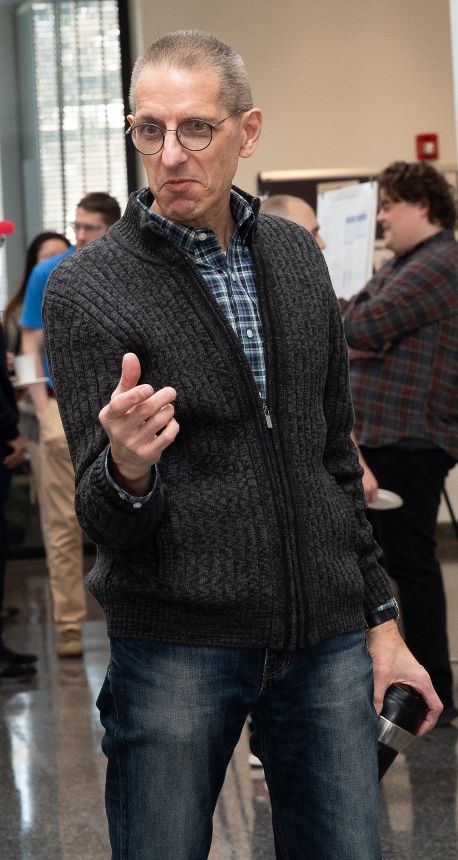 Math professor enthusiastically explains his research