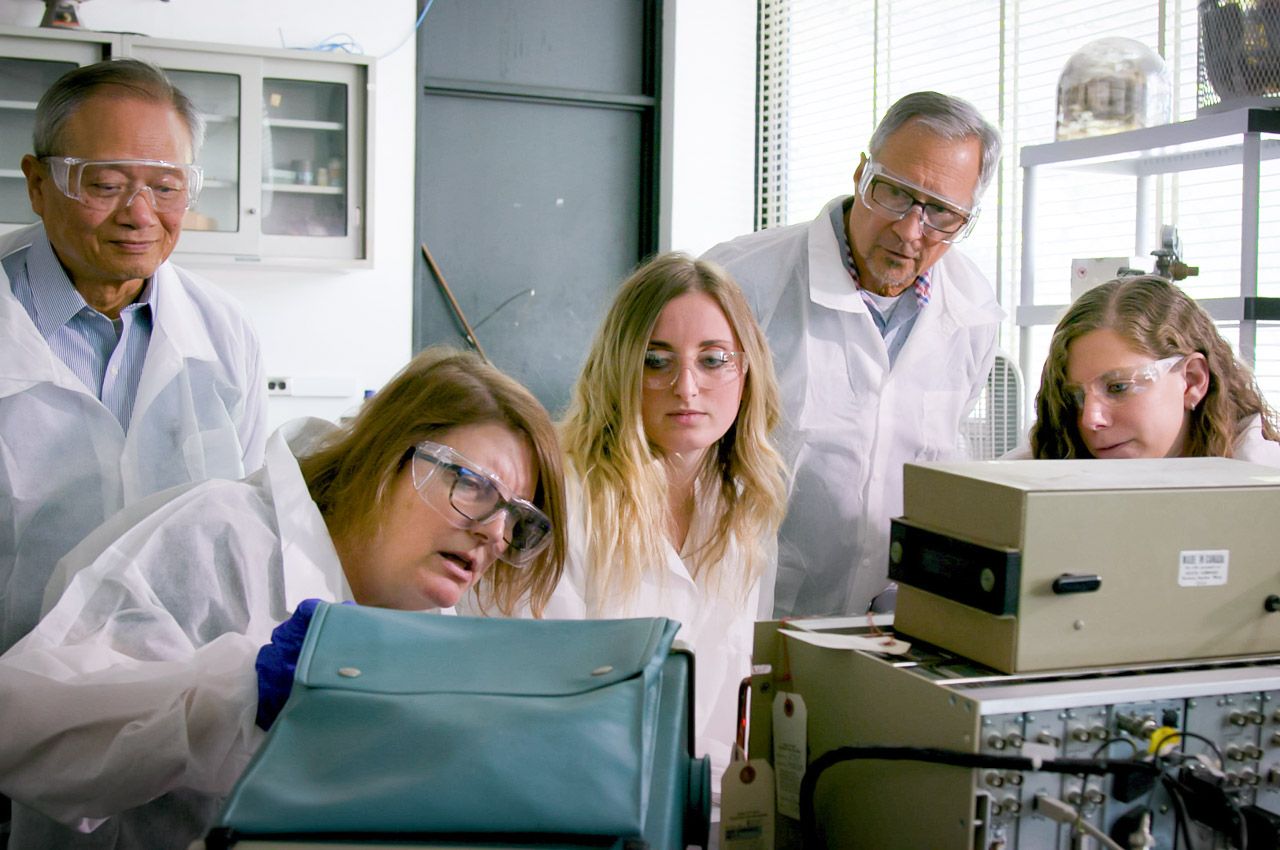 Photo of students and faculty at work in physics radiation lab