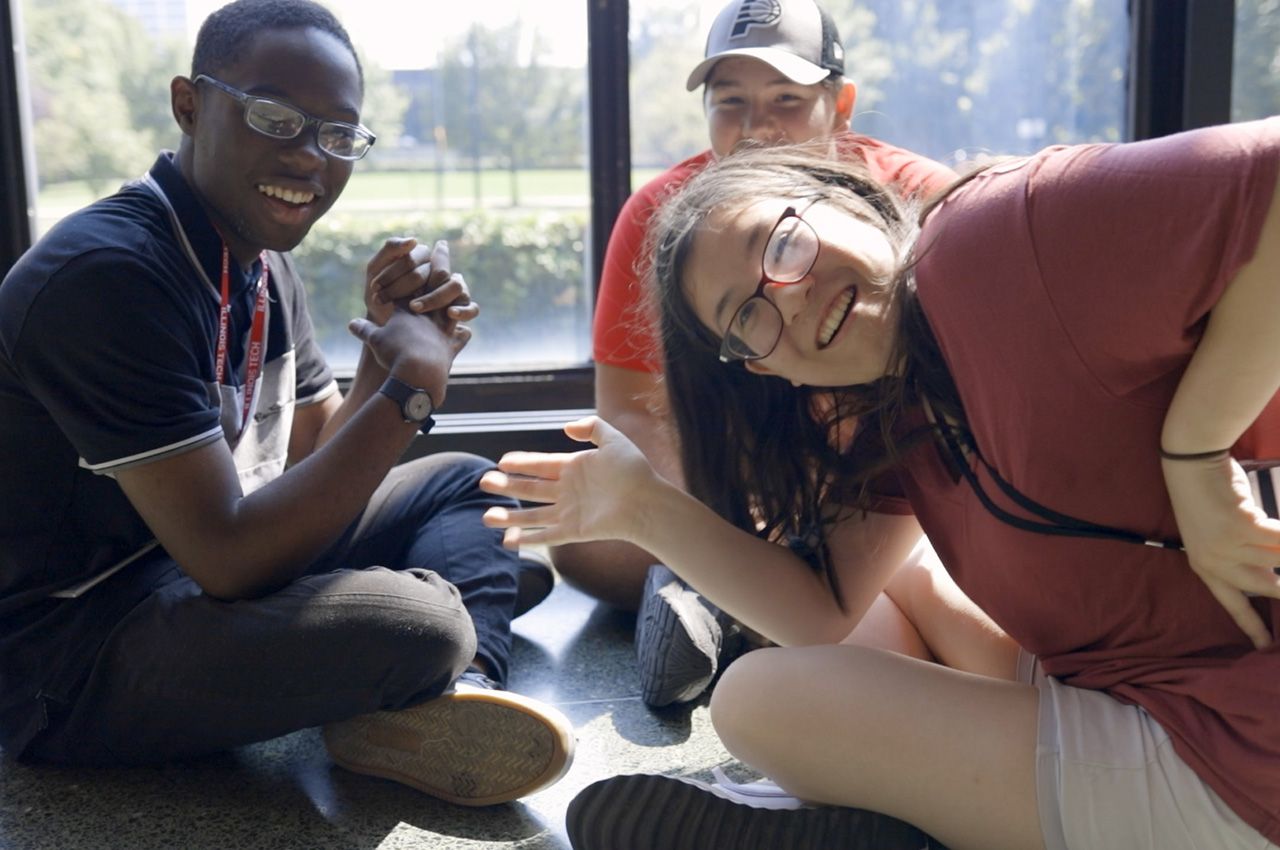Illinois Tech students wave during a Welcome Week activity