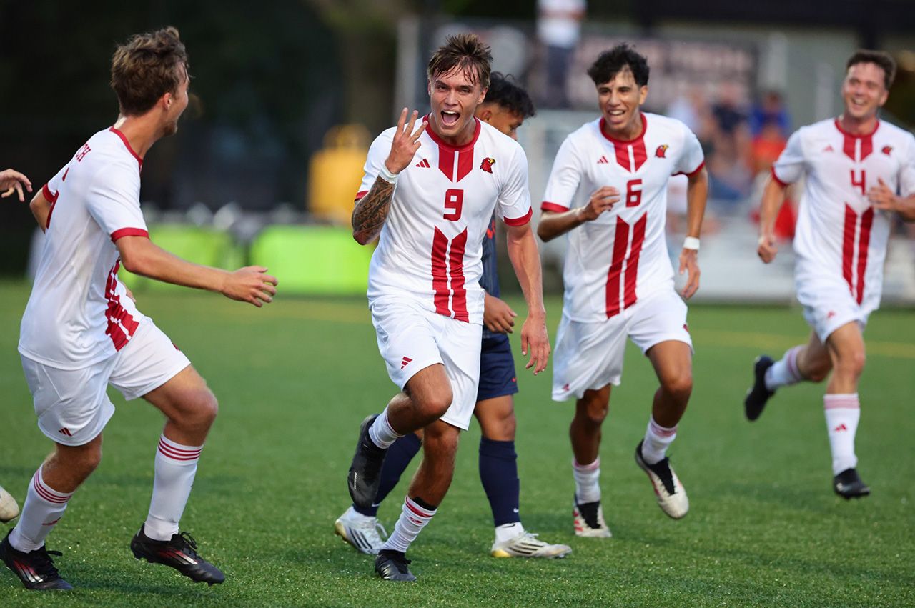 Illinois Tech men's soccer players celebrate during a game