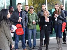 Seven students and tour guide outside for tour of Illinois Tech Mies Campus