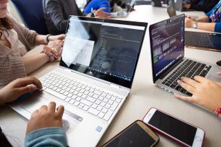 Illinois Tech students work on code