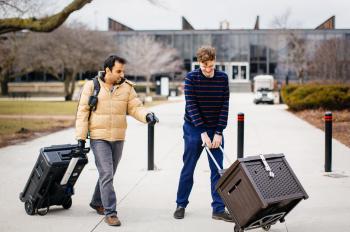 Photo of Parham Azimi and Brent Stephens walking on campus