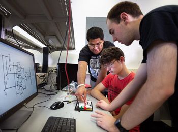 Electrical engineering students at work in a lab at Illinois Tech