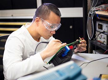 Student working on electronics