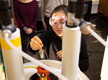 Student conducting research in a chemistry lab