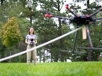 Student working a drone at Morton Arboretum