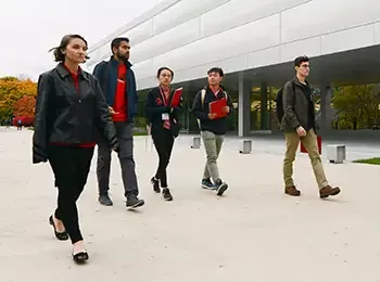 five students walking along the Kaplan Institute