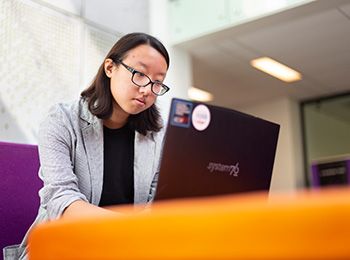 Person sitting with laptop