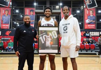 Illinios Tech men's basketball player Garrison Carter is honored for scoring 1,000 career points