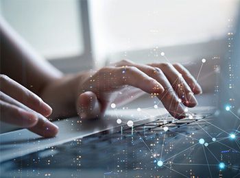 Hands typing on keyboard