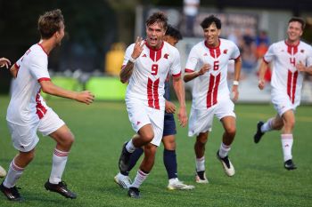 Illinois Tech men's soccer players celebrate during a game