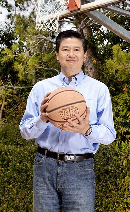 Victor Tsao standing with a basketball