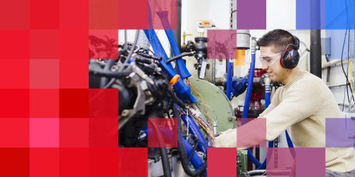 Illinois Tech Mechanical, Materials, and Aerospace Engineering student in lab with machinery 