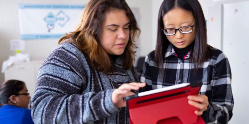 Two Illinois Tech students work on a tablet