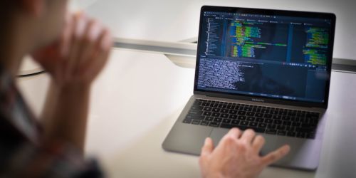 An Illinois Tech student works on code