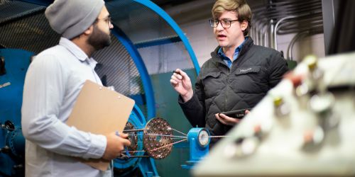 An Illinois Tech talks to a colleague at Lake Cable