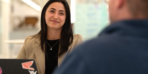 Illinois Tech psychology alumna Julia Honda works on a laptop