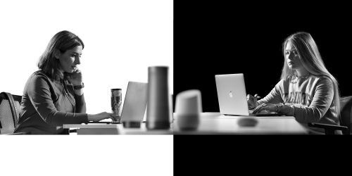 Illinois Tech students work on laptops surrounded by technology