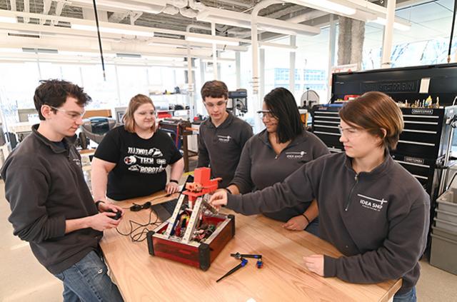 Students working in the Idea Shop on a robot