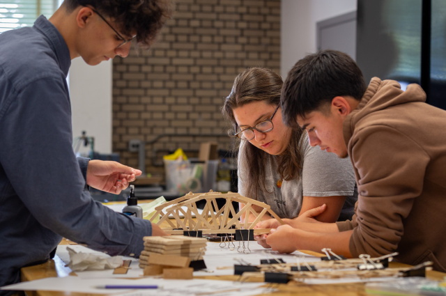 high school students work on models of bridges at Illinois Tech summer program