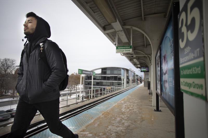 A commuter student exits the Green Line platform on 35th street