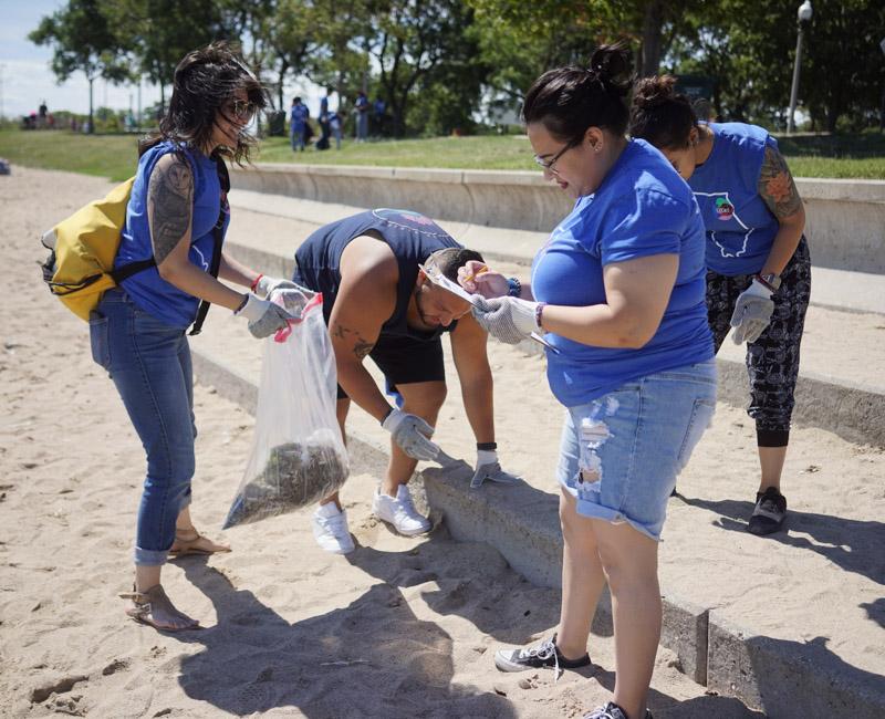 Photo of students helping clean up nearby beach