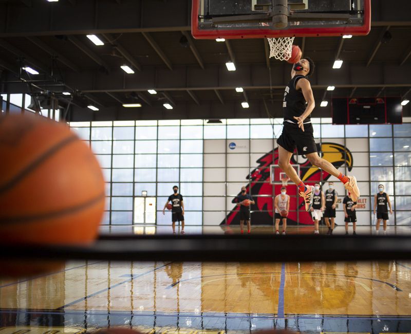 A student dunks a basketball