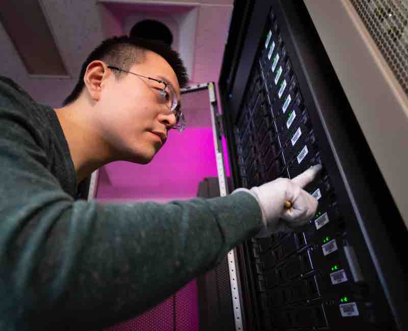 Student examines computer servers
