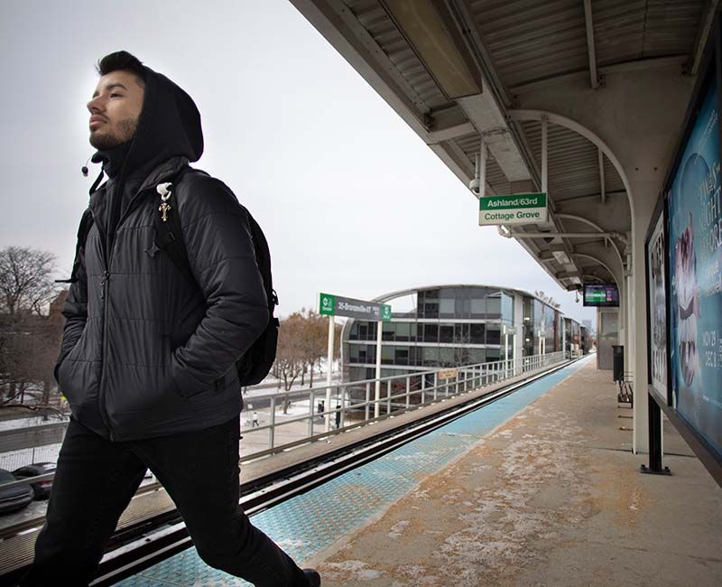 Student walking on the Green Line stop