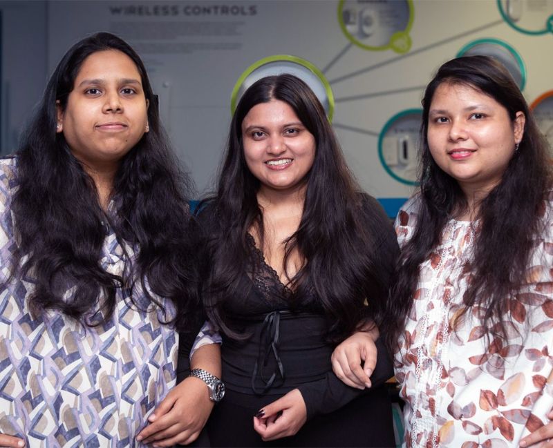 Women stand in hero pose at Illinois Tech's SmartLab