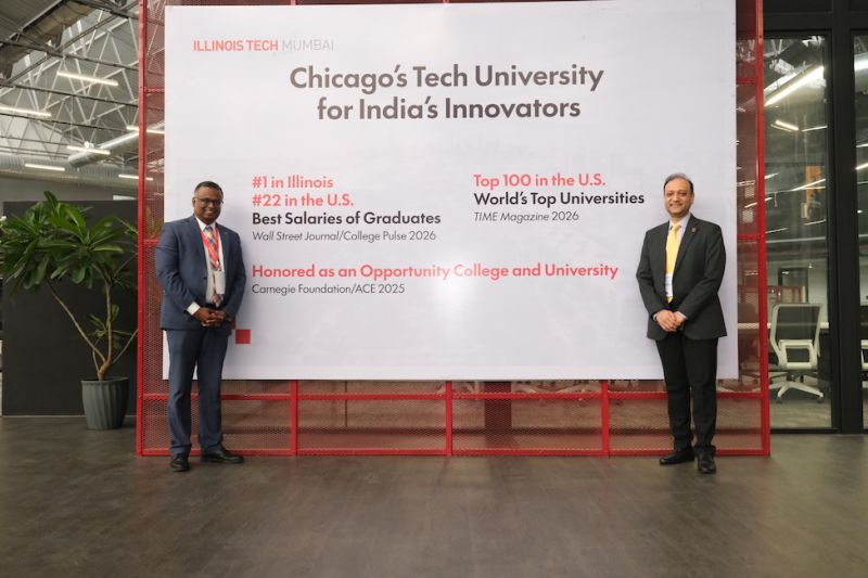 Two leaders flank a sign on the Mumbai campus noting Illinois Tech's rankings